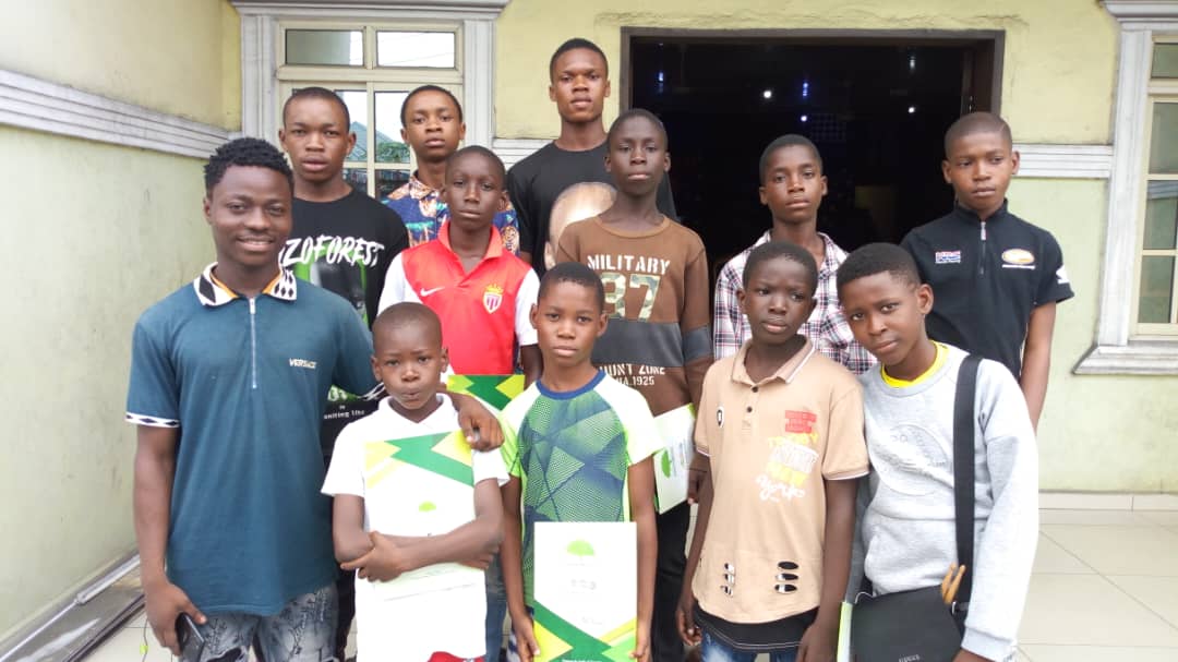 Younger participants holding their certificates of completion